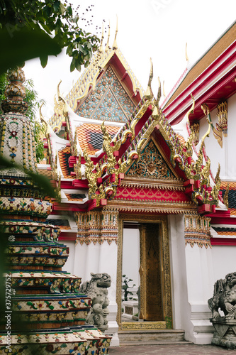 Thai temple with colorful tiles photo