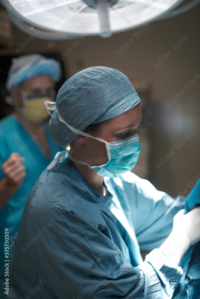 Health care professionals getting ready for operation Health care professionals getting ready for operation