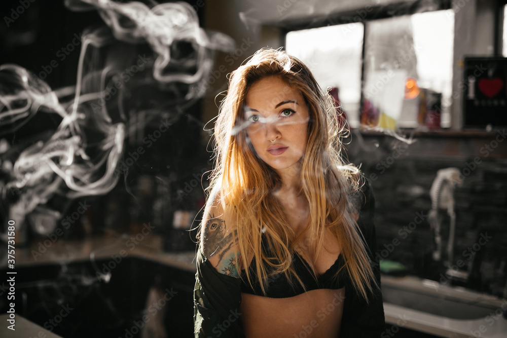 Young woman starting her morning in a sensual way. Young woman starting her morning in a sensual way.
