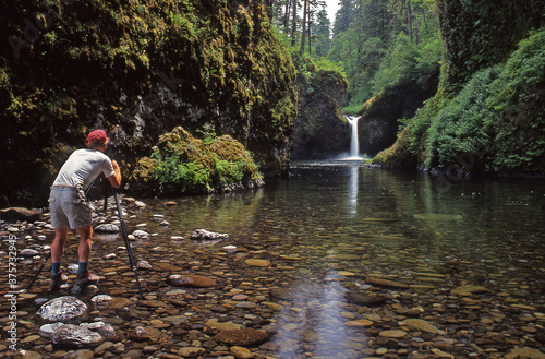 photographer at Punchbowl Falls in the Columbia River Gorge Eagle Creek waterfalls tripod photo