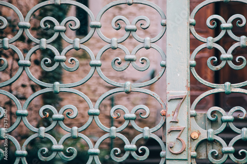 Green wrought iron gate at a house in Florence