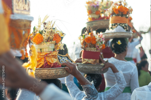 Balinese women carry offerings on their heads