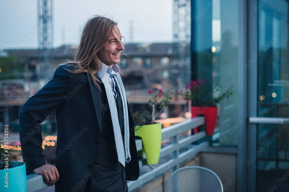 Young Businessman Smiling on Rooftop Young Businessman Smiling on Rooftop