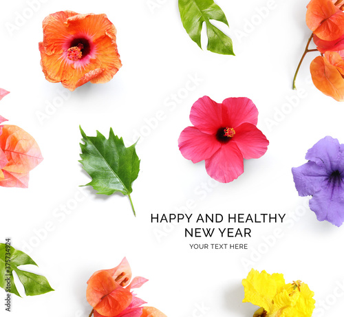 Creative happy and healthy new year card made of  flowers on the white background. Flowers happy new year  top view  festive greeting card. 