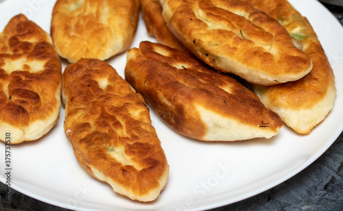 Fried pies on a plate, cooking.