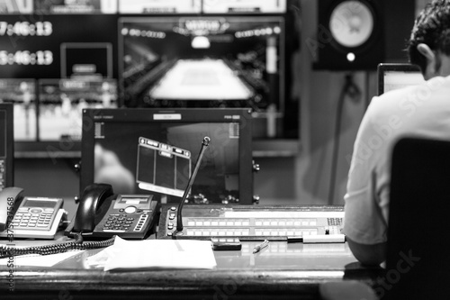 Operator in control room at tv station photo