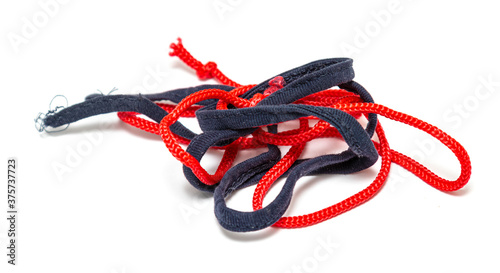 Rope with knots, rags on a white background.