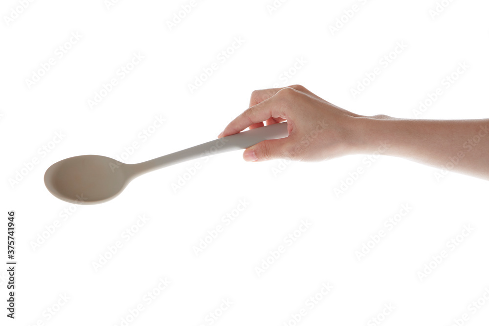hand holding silicon spatula down. hand holding silicon spatula down.