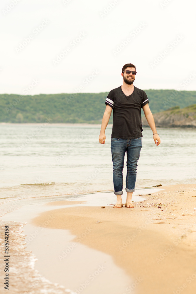 Man walking at the beach Man walking at the beach