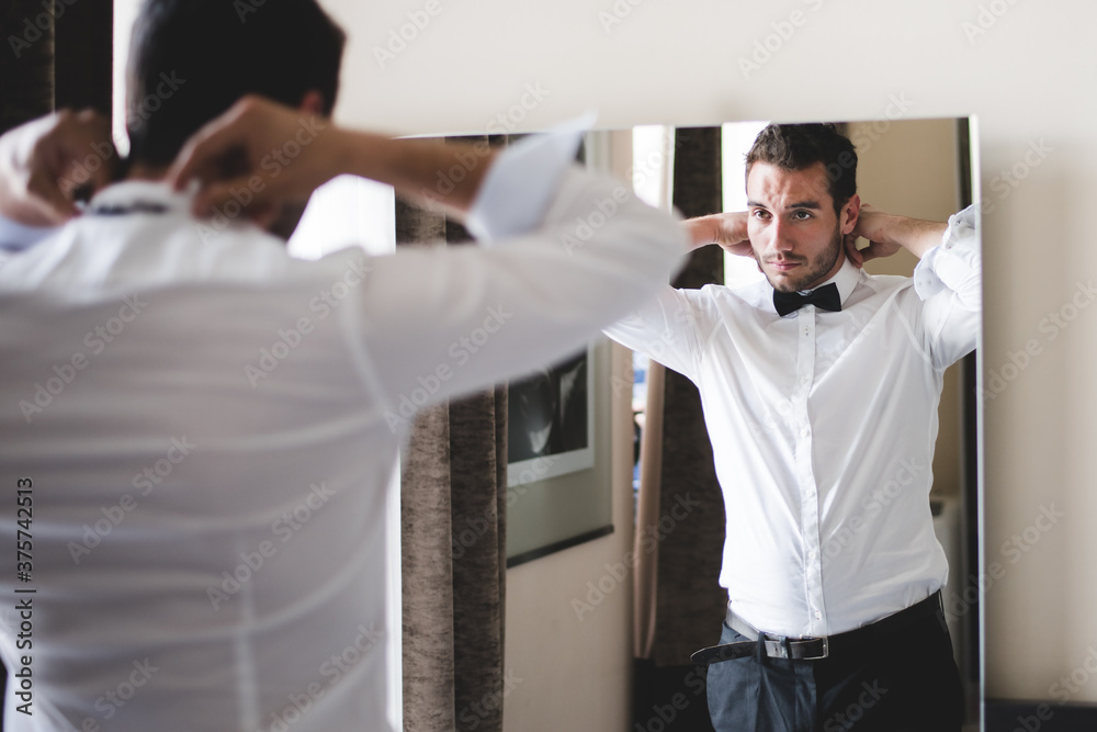 groom getting dressed groom getting dressed