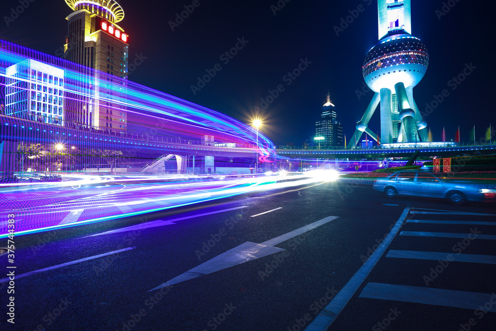 The highway car light trails of modern urban buildings The highway car light trails of modern urban buildings