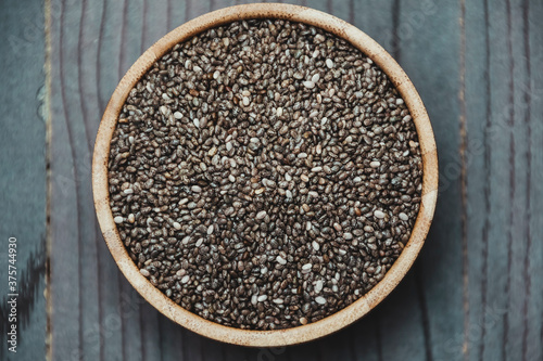 Healthy Chia seeds in a wooden bowl on the table close-up