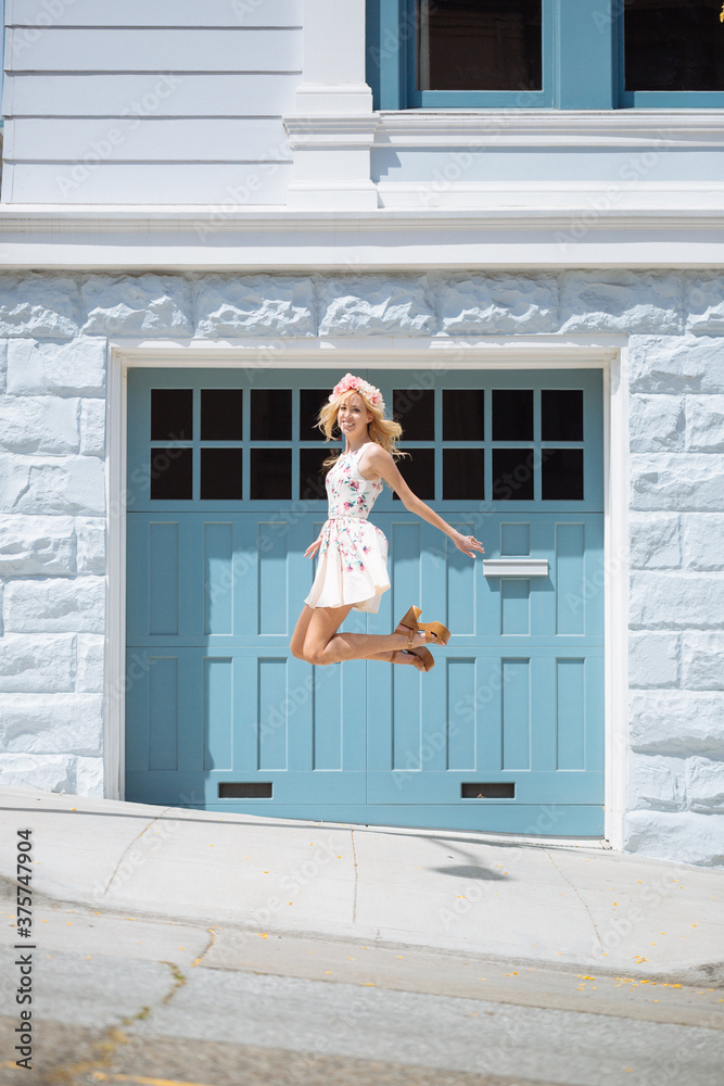 Happy woman jumping in the street Happy woman jumping in the street