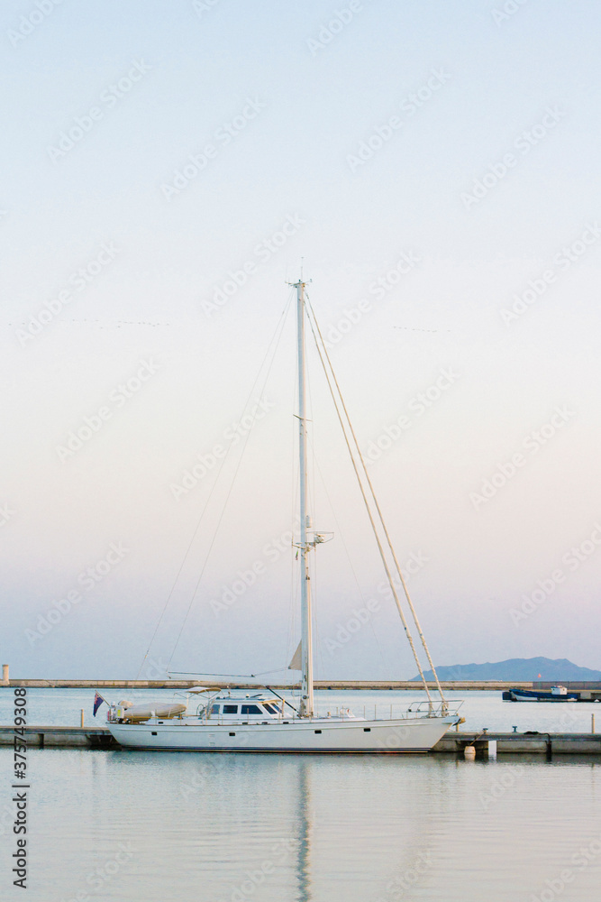 Sail boat in the port at sunset Sail boat in the port at sunset