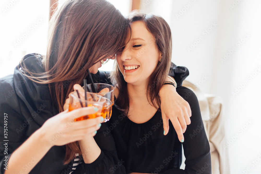 Female Best Friends Drinking an Aperitif Female Best Friends Drinking an Aperitif