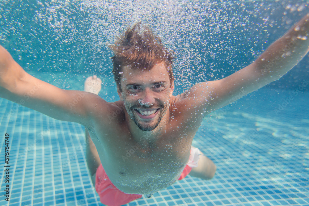 Man smiling underwater Man smiling underwater