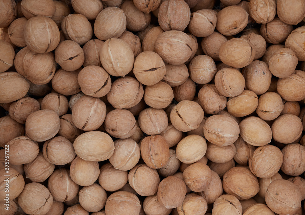 Top view of walnuts in nutshells Top view of walnuts in nutshells
