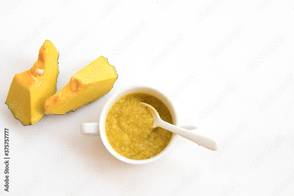 Φωτογραφία mix rice gruel with  pumpkin healthy foods health care for baby eats breakfast a