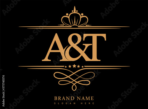 AT Initial logo, Ampersand initial logo gold with crown and classic pattern.