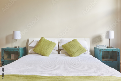 Bed and Side Tables in Light Filled Room