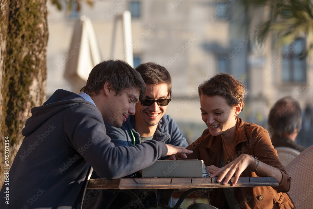 Friends Using Digital Tablet Friends Using Digital Tablet