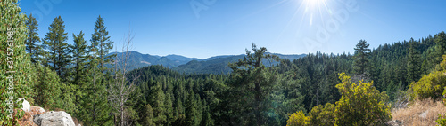 Panoramic photo of heavily wooded mountains in Southern Oregon