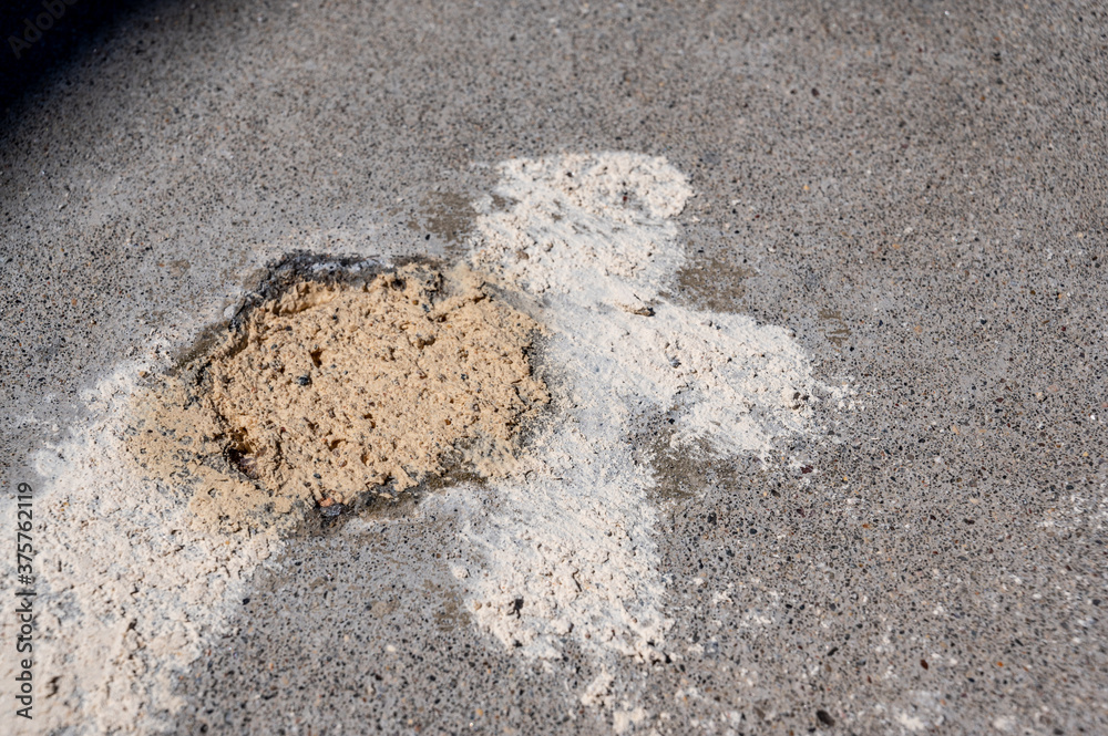 Filled in mud jacking drilled holes in concrete pavement Stock Photo Adobe Stock