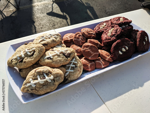 Football Shaped Cookies, Chocolate Chip, Sugar Cookies, and Red Velvet Cookies with White Laces at a Tailgate