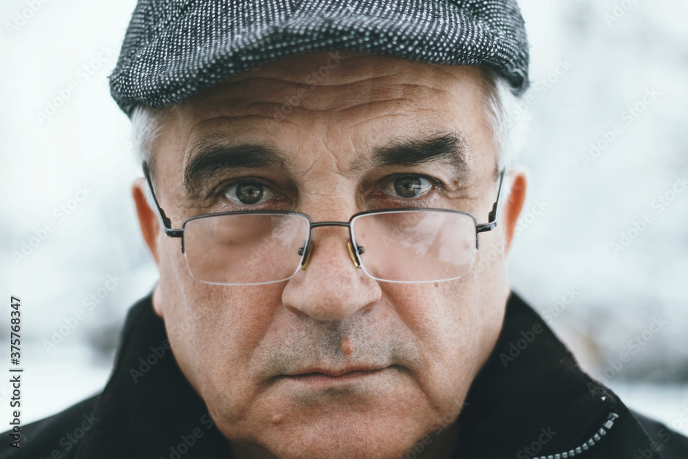 Portrait of an old man looking at camera Portrait of an old man looking at camera