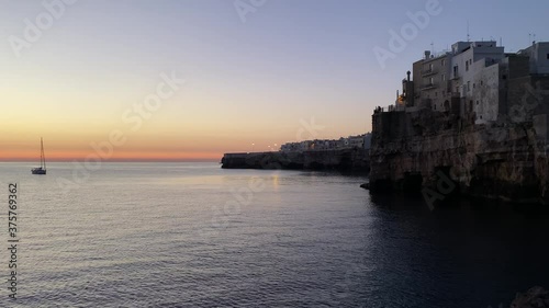 Video of the sunrise of Polignano a mare, Puglia, Italy. Cliff overlooking the sea photo