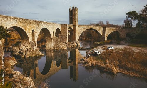 View of the medieval bridge and the river of Besalu. Girona, Spain. photo