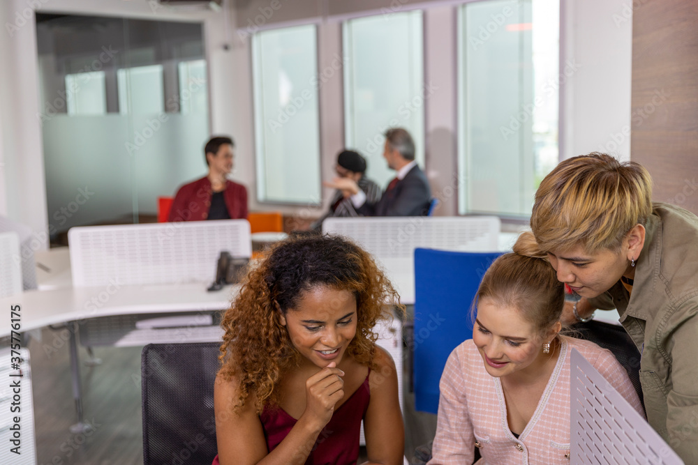 Diverse ethnicities in a business office. Workers from different races discuss and support each other for great success. Gender equality in private office Diverse ethnicities in a business office. Workers from different races discuss and support each other for great success. Gender equality in private office