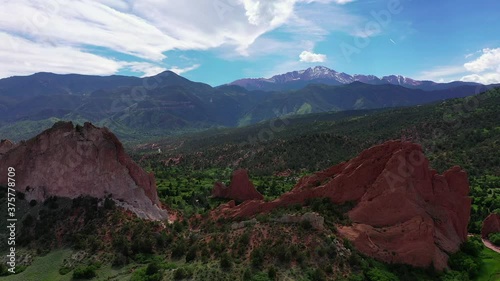 red rocks with mountains in the background