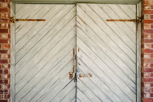 rustic timber plank door with diagonal lengths creating a chevron pattern