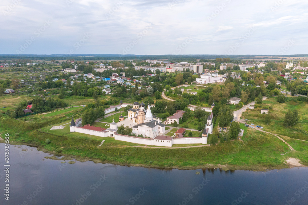 Picturesque view of small ancient town Staritsa with Staritskiy Holy Dormition Monastery on the Volga River in Russia. Picturesque view of small ancient town Staritsa with Staritskiy Holy Dormition Monastery on the Volga River in Russia.