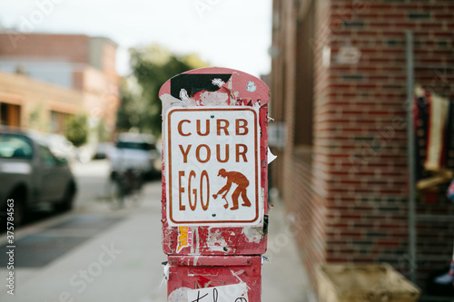 Curb your ego sign