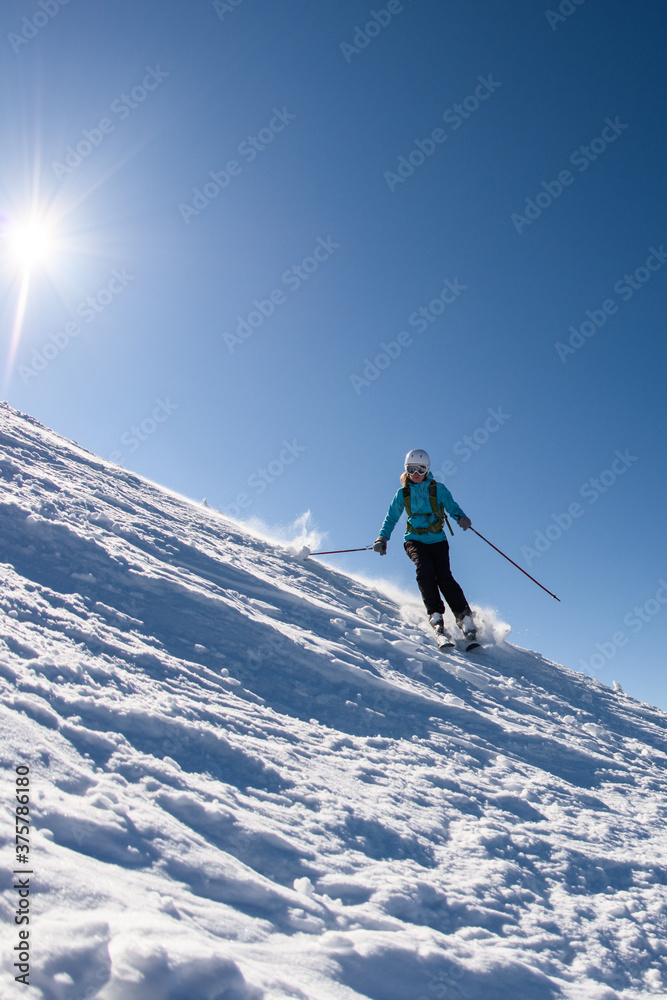 custom made wallpaper toronto digitalWoman skiing downhill on a sunny day