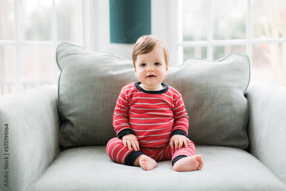 Adorable young boy sitting in a chair Adorable young boy sitting in a chair