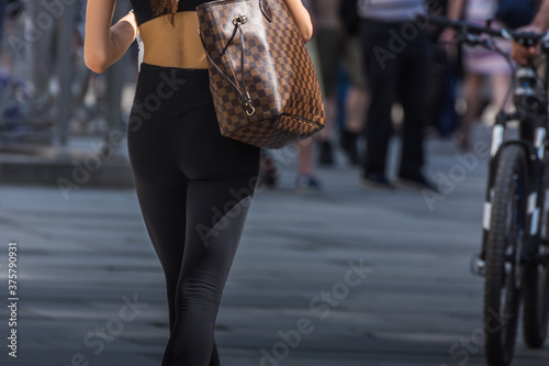 young woman with tight black pant