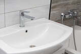 Modern and stylish interior of the bathroom in the apartment, close-up of the washbasin.