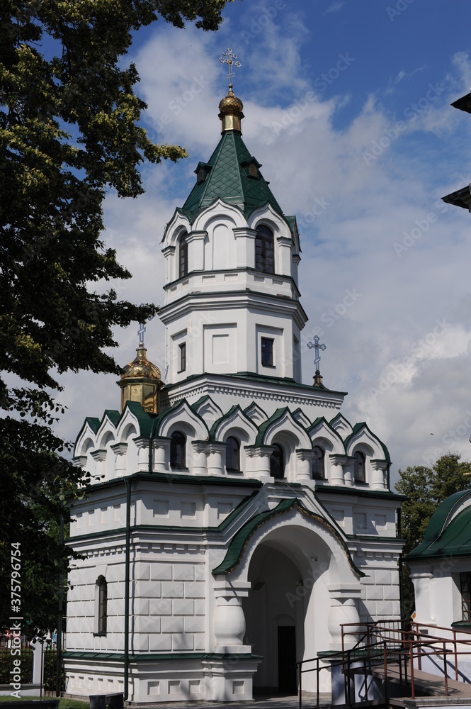 St. Alexander Nevsky Orthodox Church in Sokolka city in eastern Poland in summer over blue sky with clouds