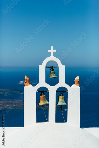 Bell tower with the Egean sea on the background photo