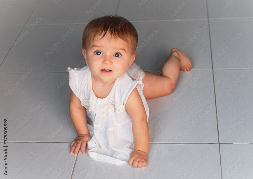 happy baby crawling on the tiled floor happy baby crawling on the tiled floor