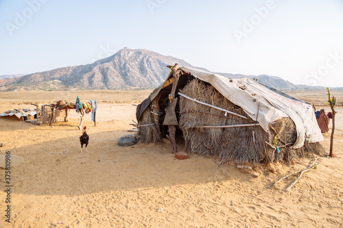 Hay hut in desertic rural village in Rajasthan, India. photo