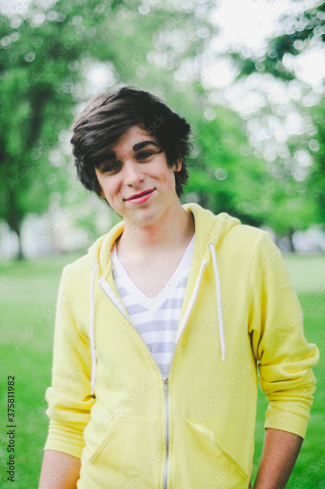 A teenager smiling at the camera