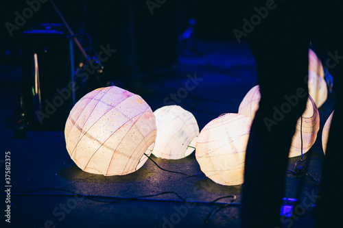 Paper lanterns adorning a stage photo