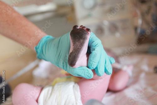 Ink on Newborn Baby's Foot For Birth Certificate photo