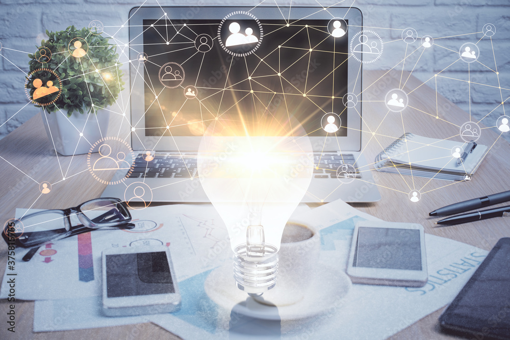 Computer on desktop with social network hologram. Double exposure. Concept of international people connections. Computer on desktop with social network hologram. Double exposure. Concept of international people connections.