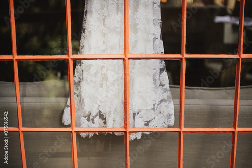 Lace wedding dress in window photo