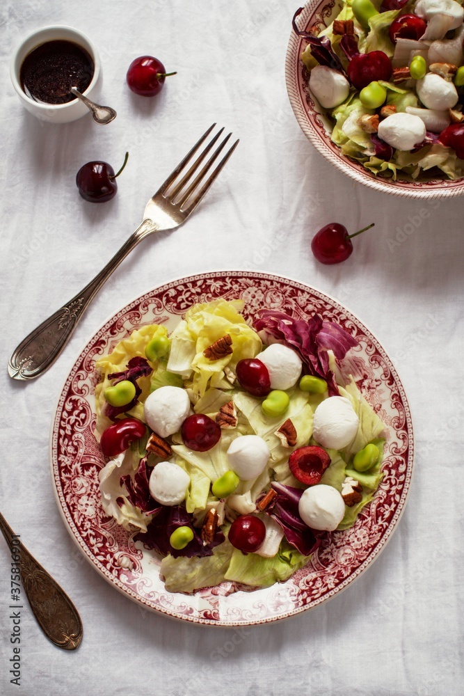 Mixed salad with cherries, pecan nuts and mozzarella cheese Mixed salad with cherries, pecan nuts and mozzarella cheese